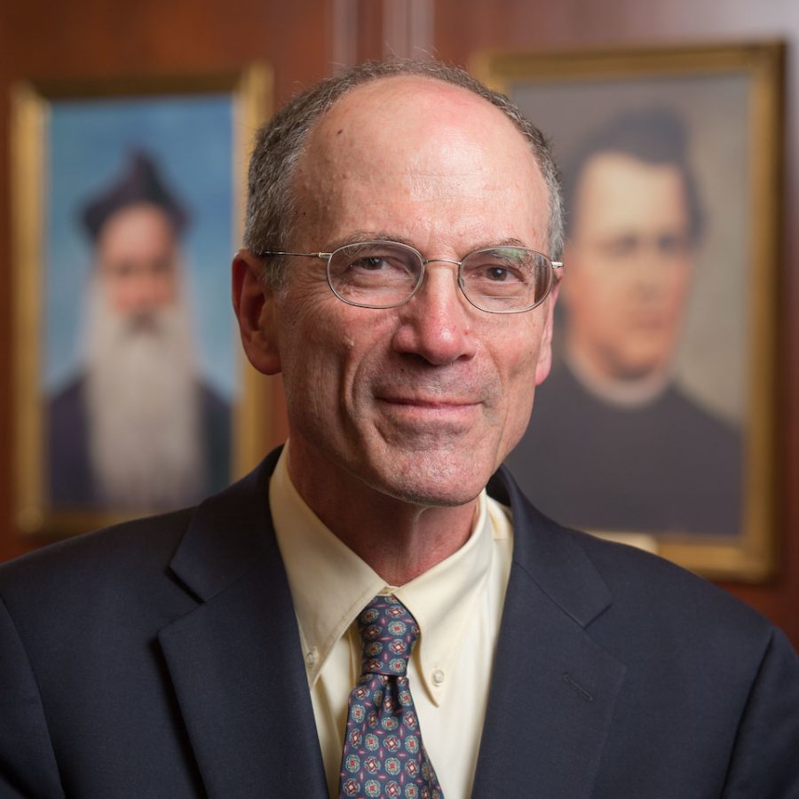 Dr. Mark Noll wearing a suit and tie